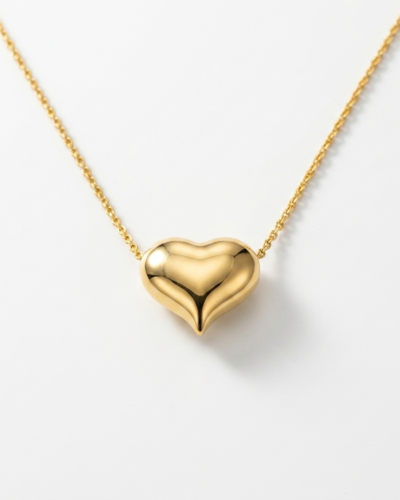 Gold toned heart shaped pendant on a gold chain. Good for gift.